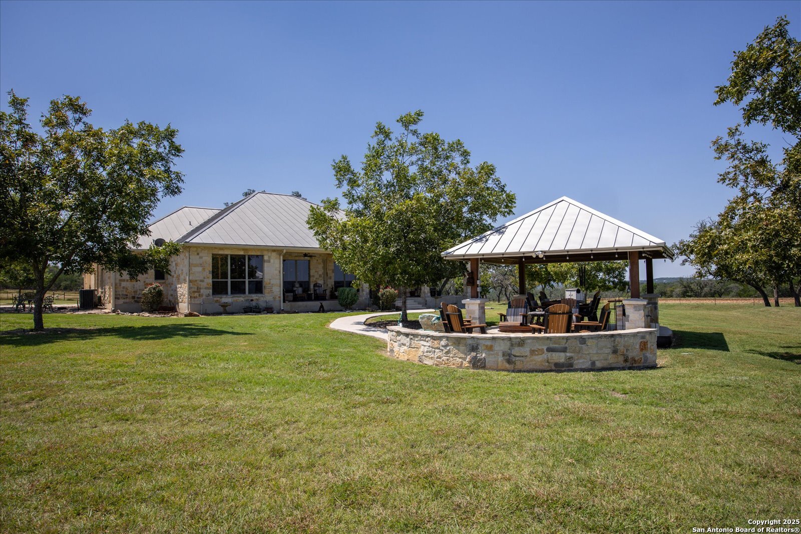 34 Cravey Road Boerne, TX 78006 - Photo 40 of 57 a view of a house with backyard and sitting area