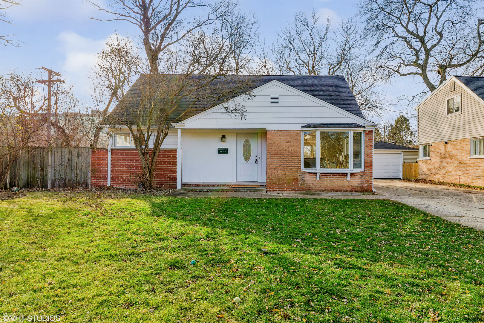 601 Long Road Glenview, IL 60025 - Photo 1 of 27 a front view of house with yard and trees