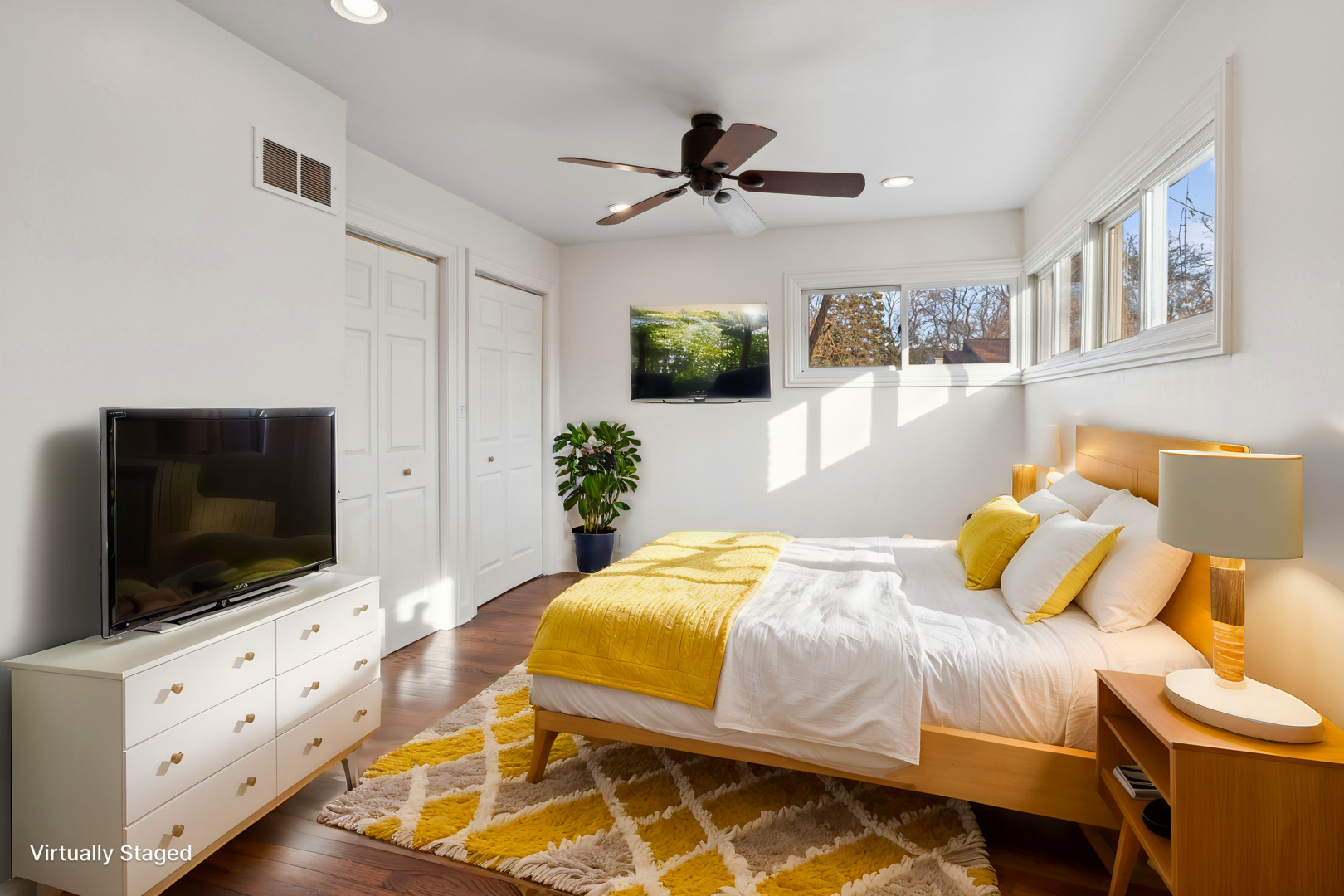 601 Long Road Glenview, IL 60025 - Photo 17 of 27 a bedroom with a bed and flat screen tv