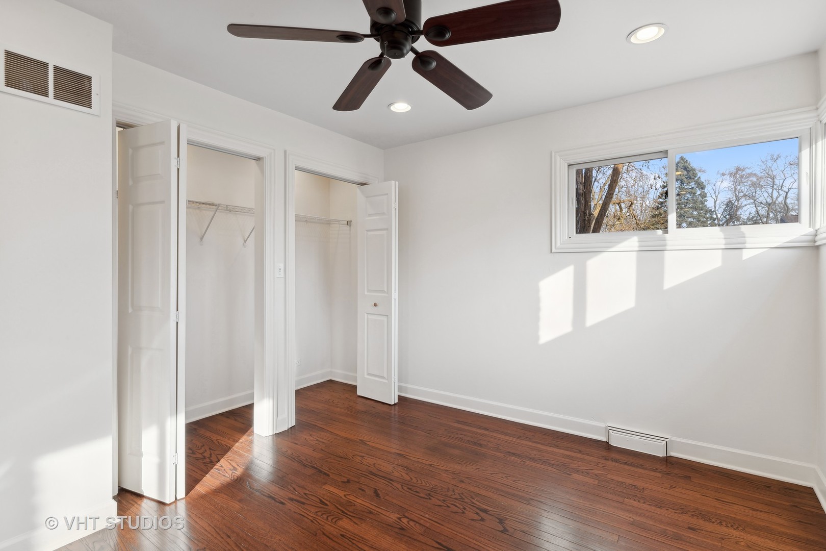 601 Long Road Glenview, IL 60025 - Photo 18 of 27 a view of empty room with wooden floor and fan