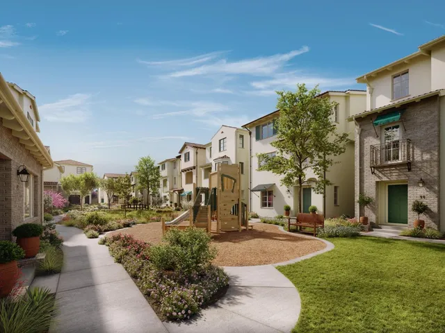 a view of a building with a yard