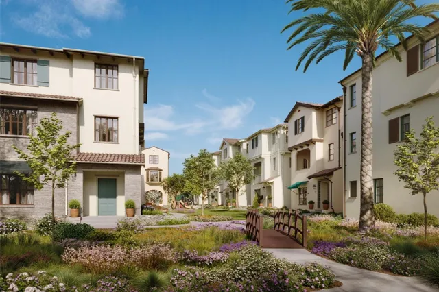 a front view of a residential houses with yard