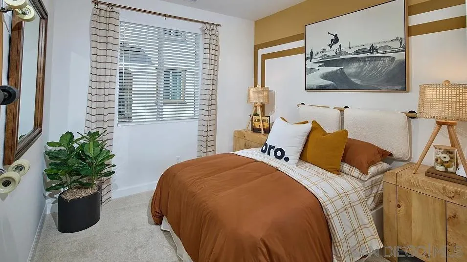 1412 Mountain Laurel Road San Marcos, CA 92078 - Photo 11 of 16 a bed room with a bed and a potted plant