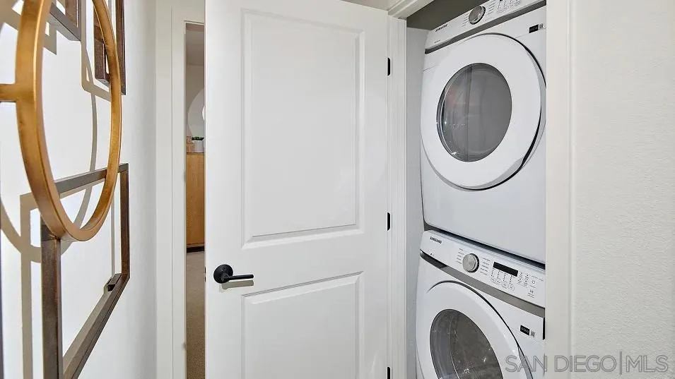 1412 Mountain Laurel Road San Marcos, CA 92078 - Photo 13 of 16 a view of a hallway with washer and dryer