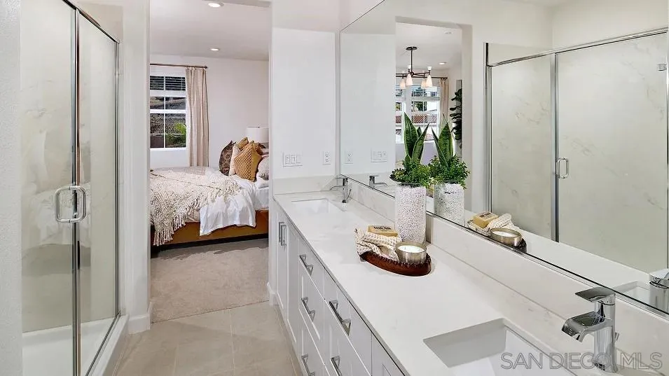 1412 Mountain Laurel Road San Marcos, CA 92078 - Photo 9 of 16 a en suite bathroom with a double vanity sink and mirror