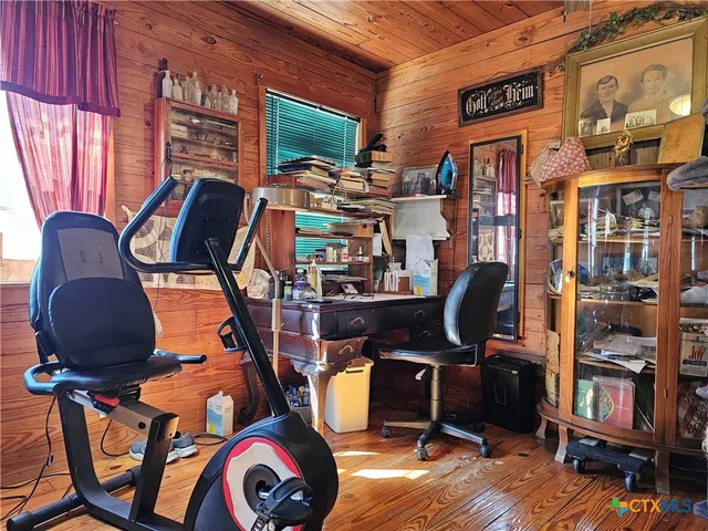 a kitchen with a sink and wooden cabinets