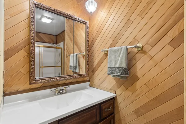 a bathroom with a sink and a mirror