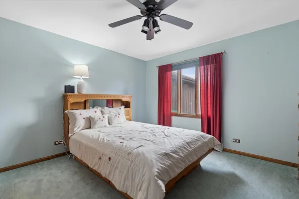 a bedroom with a bed and furniture
