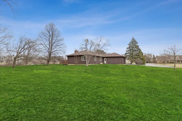a front view of house with garden