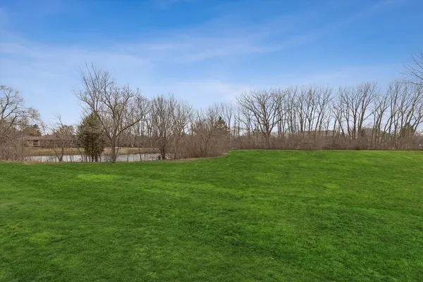 a view of lake with green space
