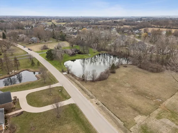 a view of a lake with a yard