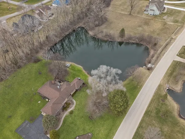 a aerial view of a house with a yard