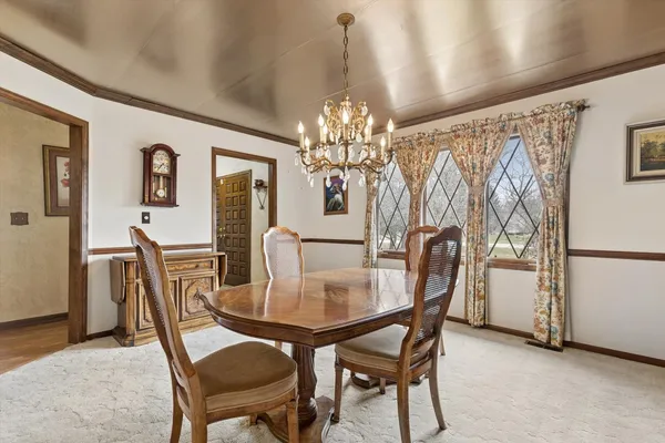 a dining room with furniture and window