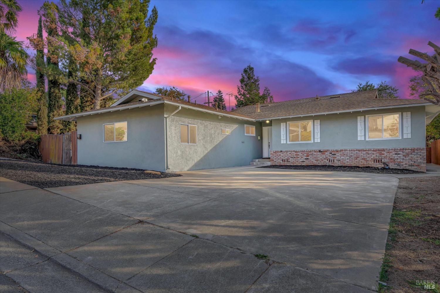 363 Springbrook Drive Vallejo, CA 94591 - Photo 1 of 1 a front view of a house with a yard and garage