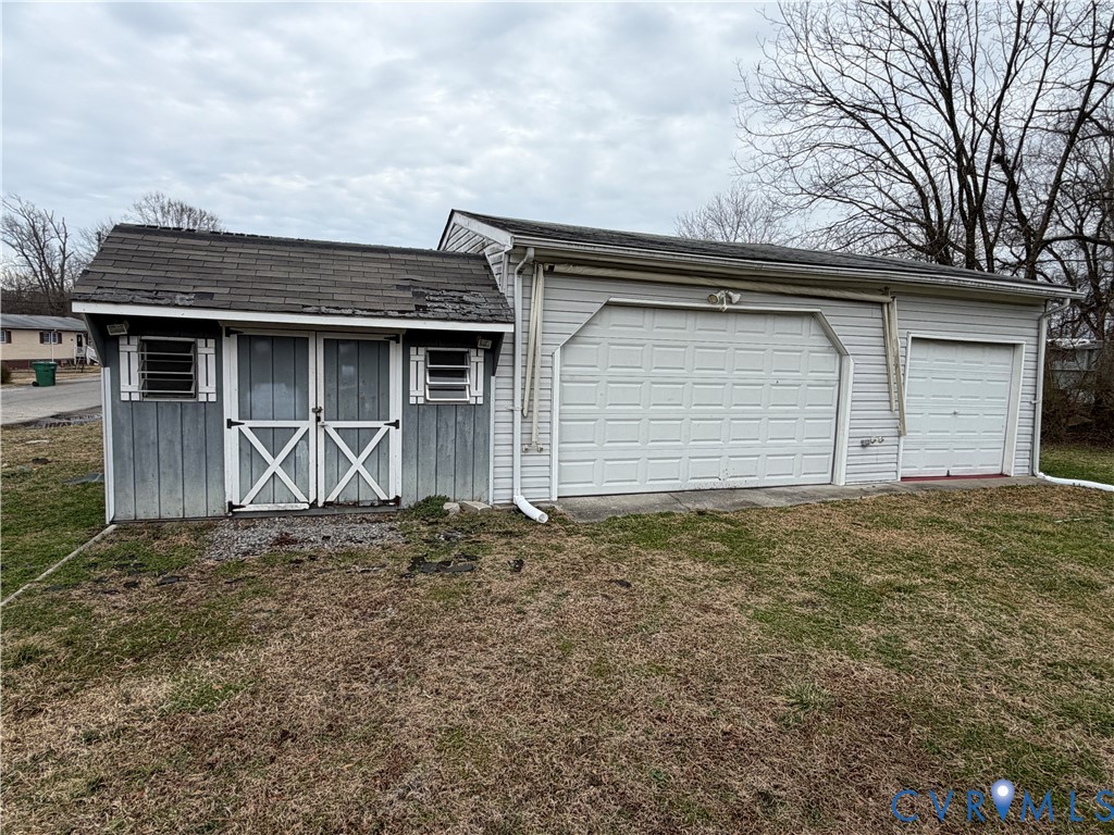 117 Pleasant Spring Avenue Waverly, VA 23890 - Photo 11 of 12 a house with trees in front of it