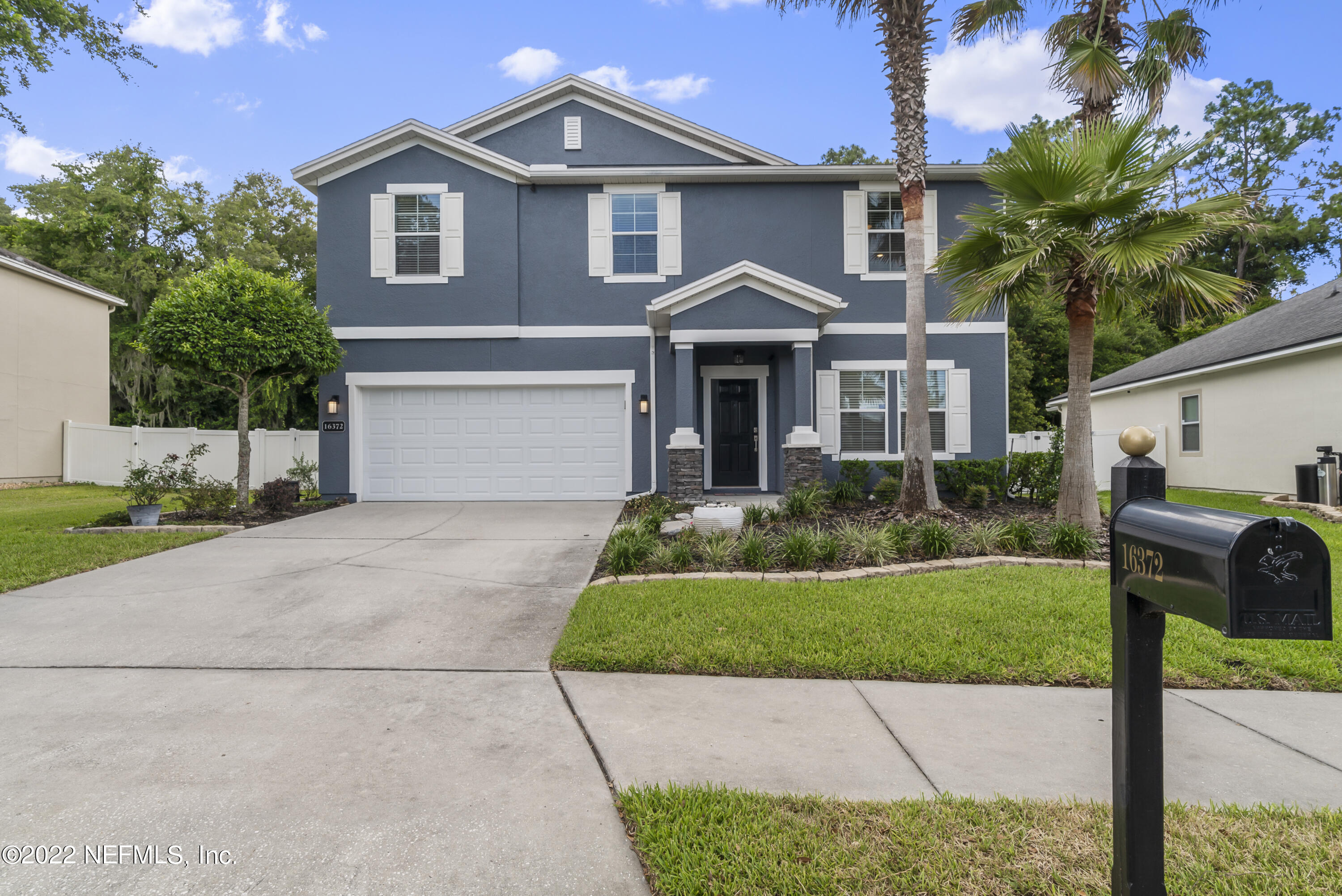 16372 Tisons Bluff Road Jacksonville, FL 32218 - Photo 1 of 51 a front view of a house with a yard