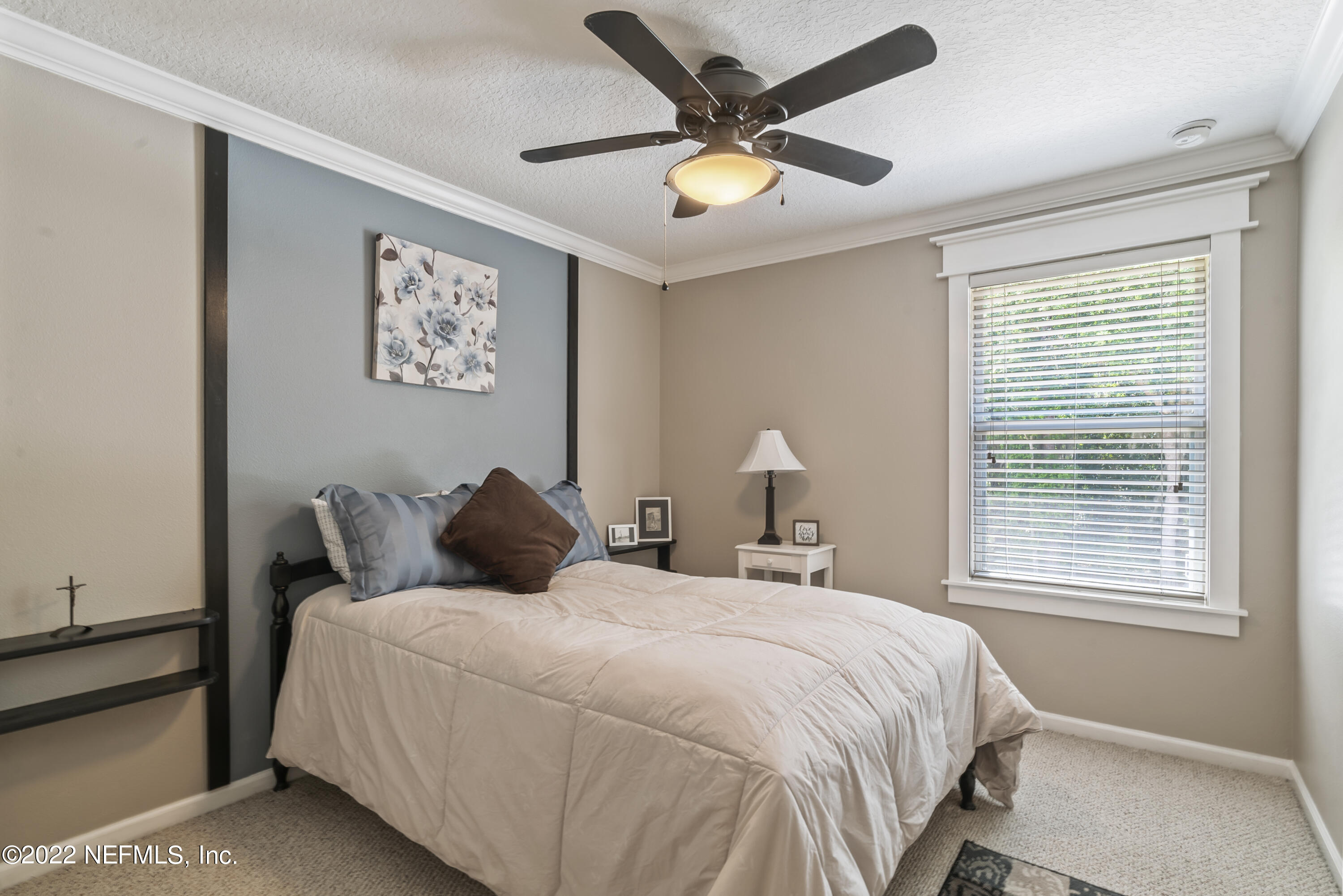 16372 Tisons Bluff Road Jacksonville, FL 32218 - Photo 35 of 51 a bedroom with a large bed and a window