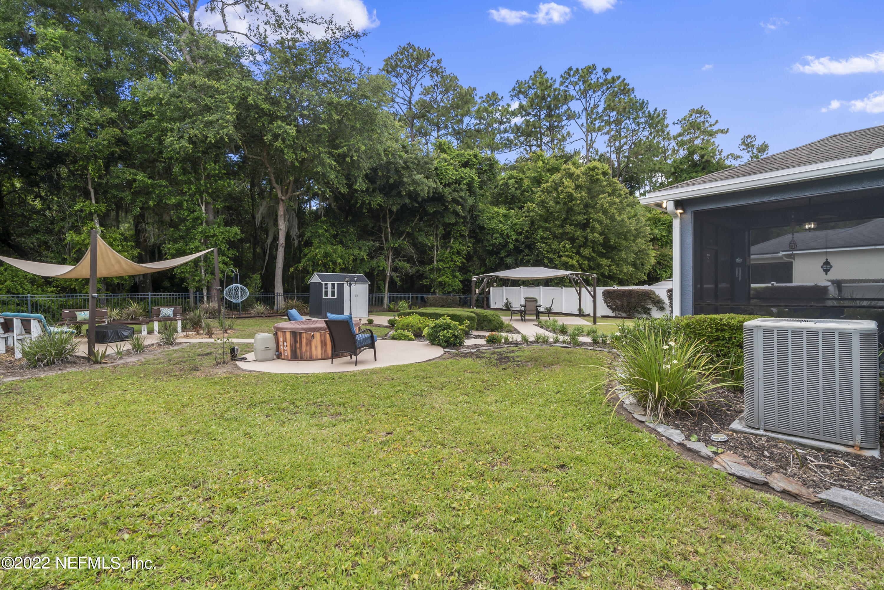 16372 Tisons Bluff Road Jacksonville, FL 32218 - Photo 44 of 51 a view of a house with backyard porch and sitting area