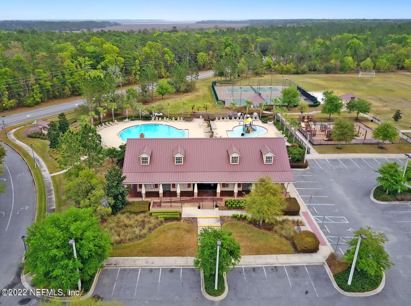 16372 Tisons Bluff Road Jacksonville, FL 32218 - Photo 49 of 51 an aerial view of a house with garden space and mountain view in back