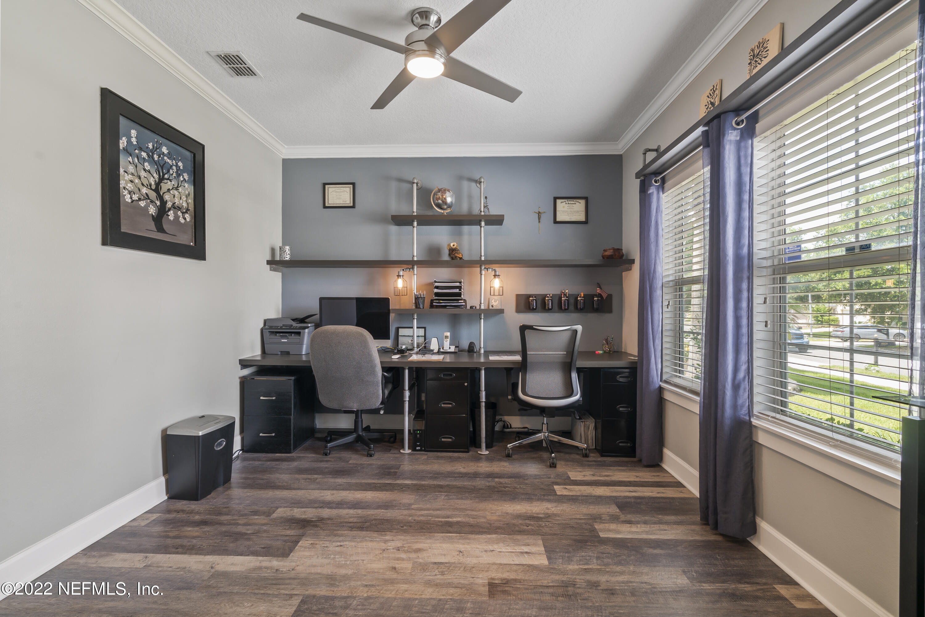 16372 Tisons Bluff Road Jacksonville, FL 32218 - Photo 7 of 51 a view of a workspace with furniture and a window