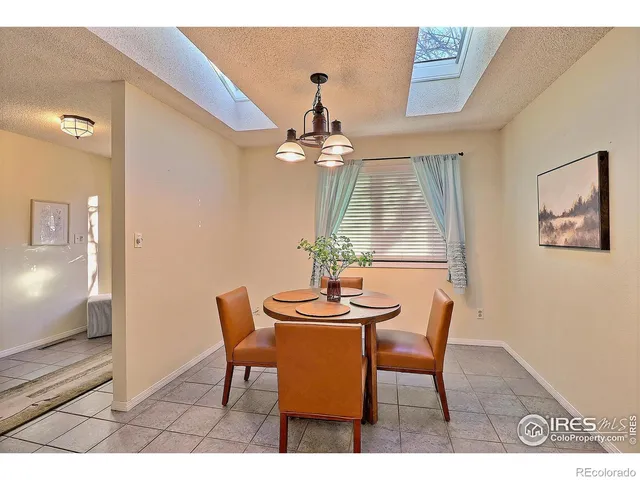 a view of a livingroom with furniture and chandelier