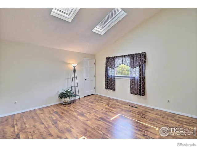 a bathroom with a granite countertop sink toilet a mirror a shower and a sink