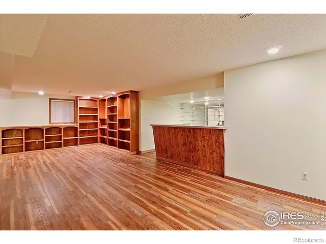 a view of a living room with a sink and dishwasher