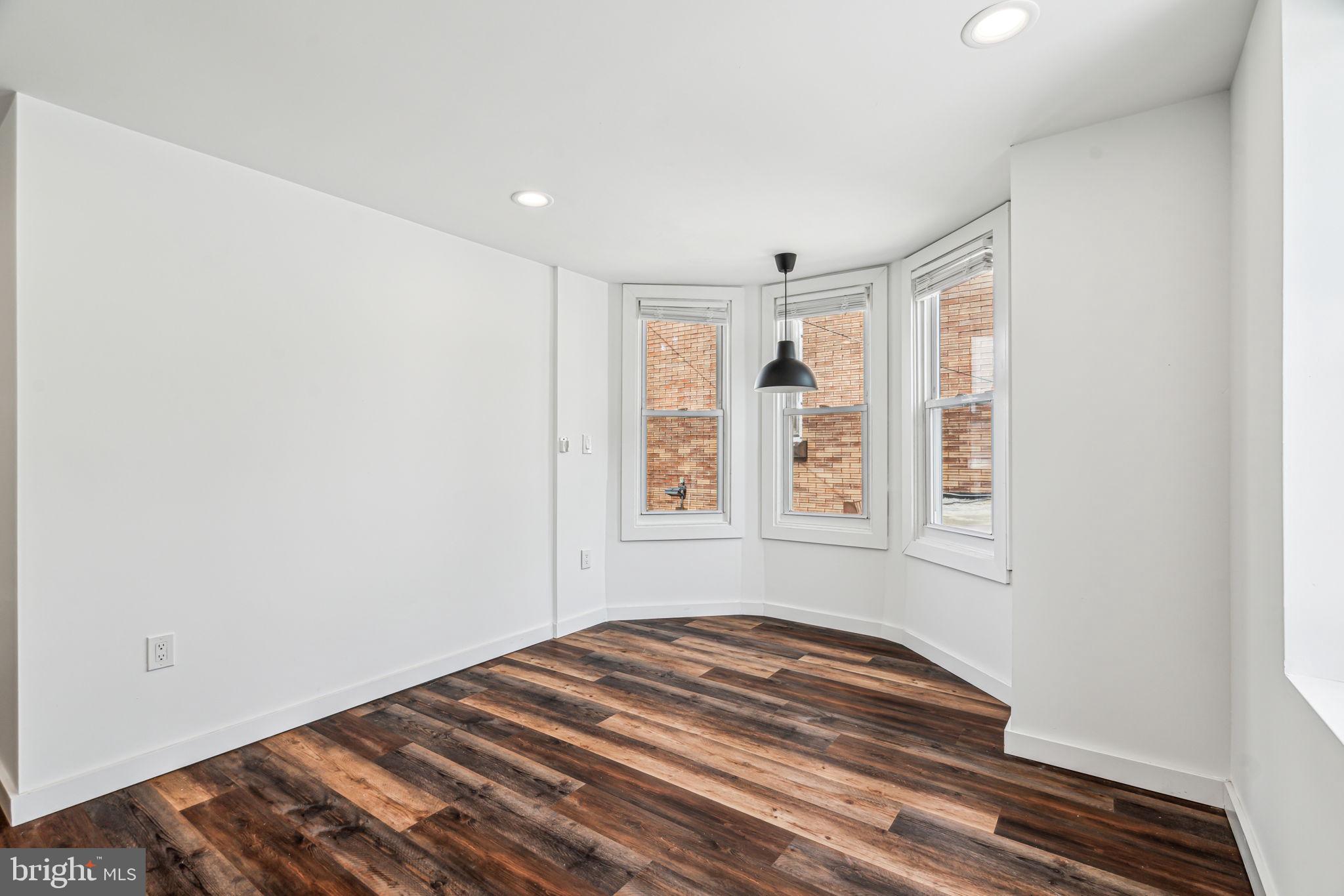 451 Green Lane Philadelphia, PA 19128 - Photo 11 of 22 a view of empty room with wooden floor and fan