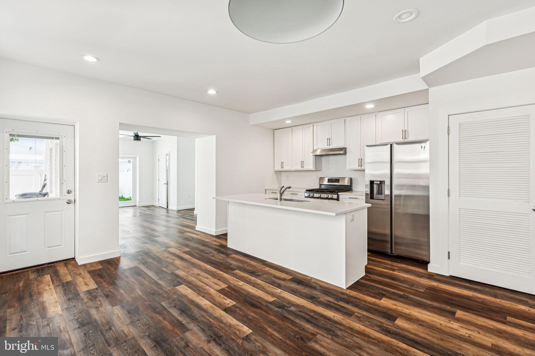 451 Green Lane Philadelphia, PA 19128 - Photo 21 of 22 a kitchen with a refrigerator and white cabinets