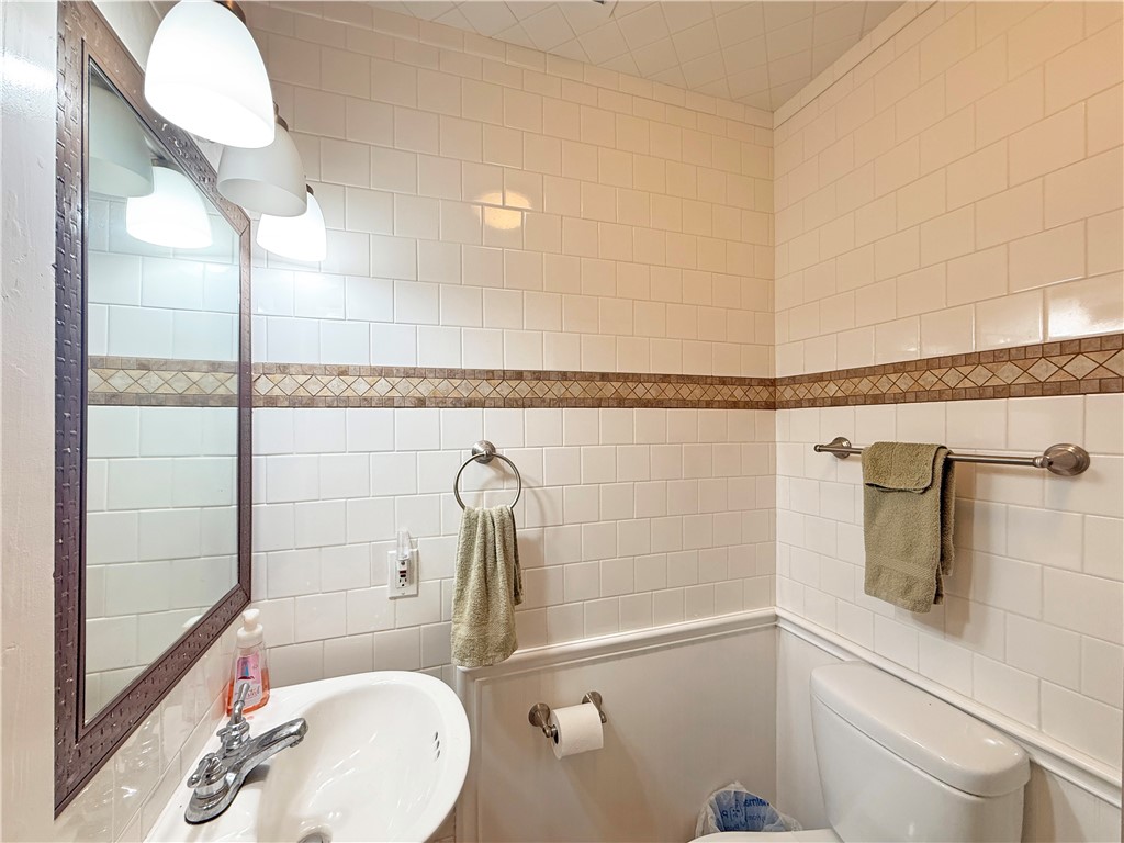 105 Copano Cove Road Rockport, TX 78382 - Photo 20 of 40 a bathroom with a sink a toilet and shower