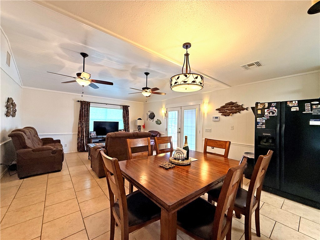 105 Copano Cove Road Rockport, TX 78382 - Photo 22 of 40 a view of a dining room with furniture