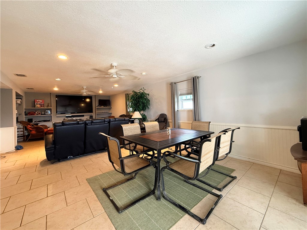 105 Copano Cove Road Rockport, TX 78382 - Photo 24 of 40 a view of a dining room with furniture