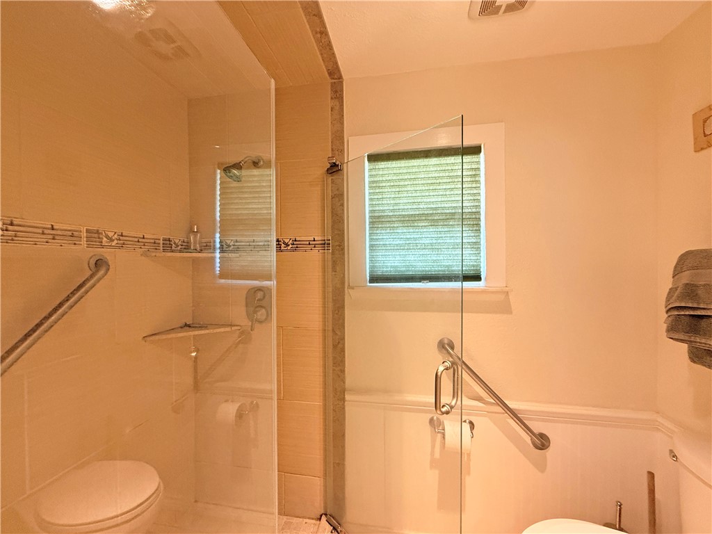 105 Copano Cove Road Rockport, TX 78382 - Photo 29 of 40 a bathroom with a toilet and a shower