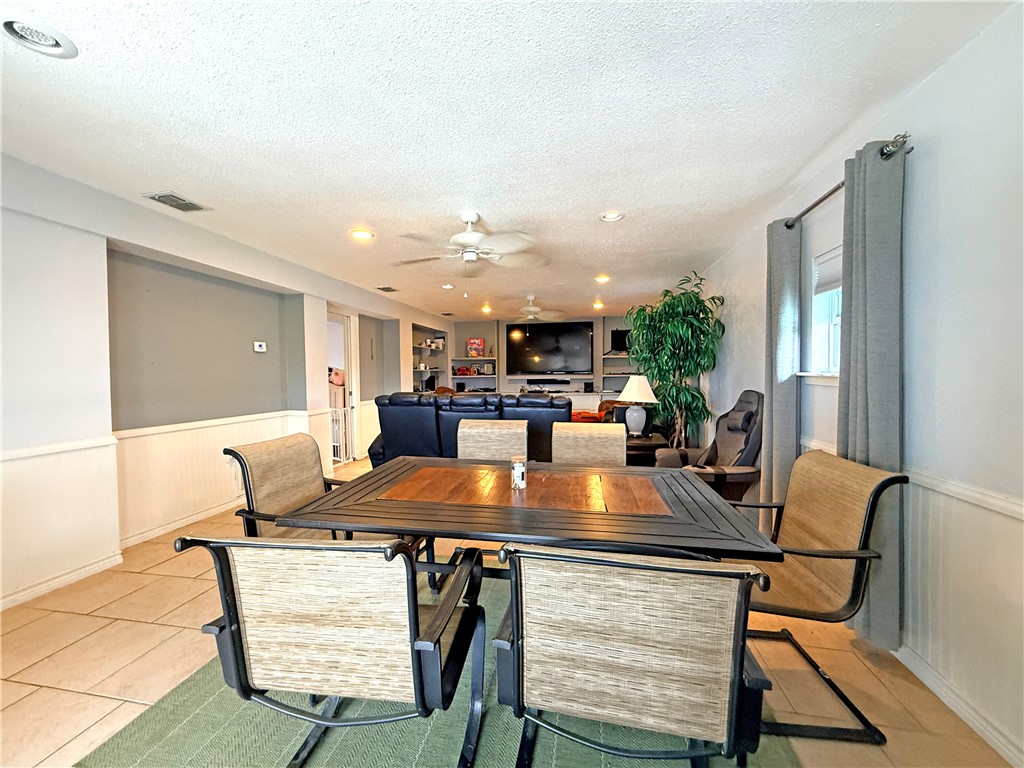 105 Copano Cove Road Rockport, TX 78382 - Photo 31 of 40 a view of a dining room with furniture