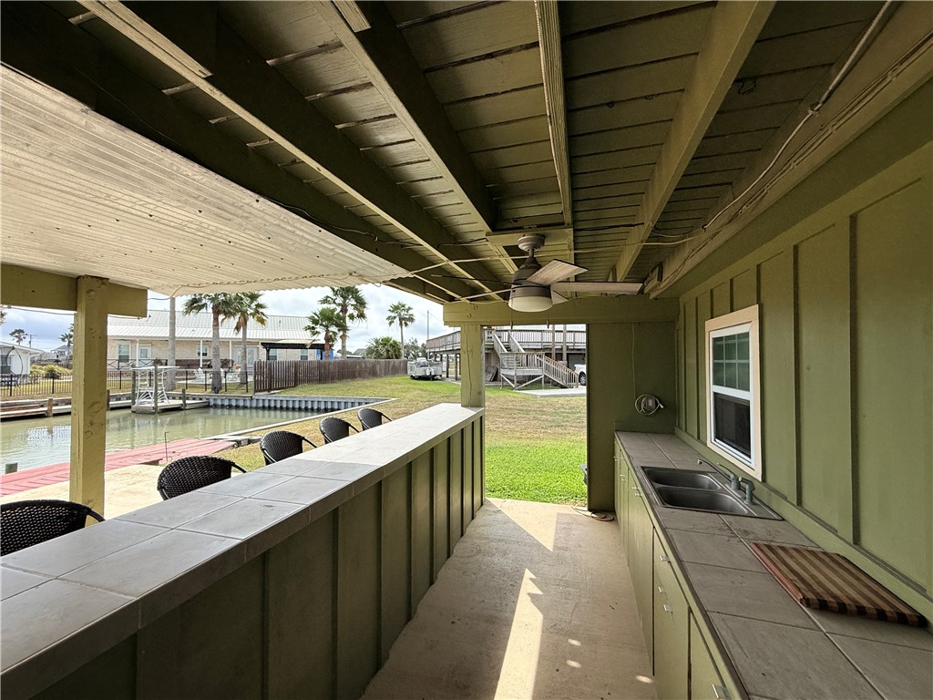 105 Copano Cove Road Rockport, TX 78382 - Photo 33 of 40 a view of a porch with wooden floor