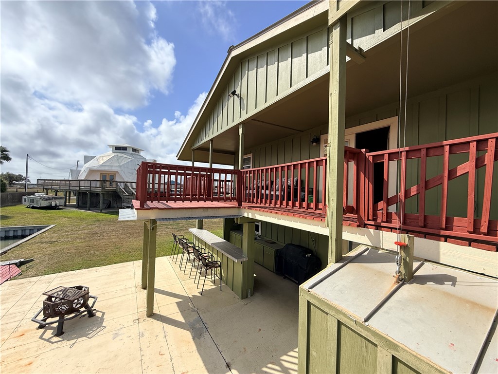 105 Copano Cove Road Rockport, TX 78382 - Photo 37 of 40 a view of a house with a wooden deck