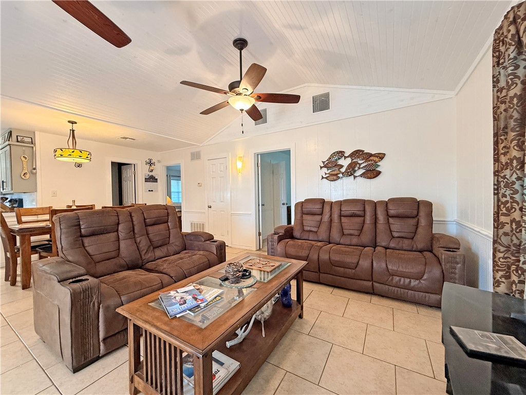 105 Copano Cove Road Rockport, TX 78382 - Photo 4 of 40 a living room with furniture and a window