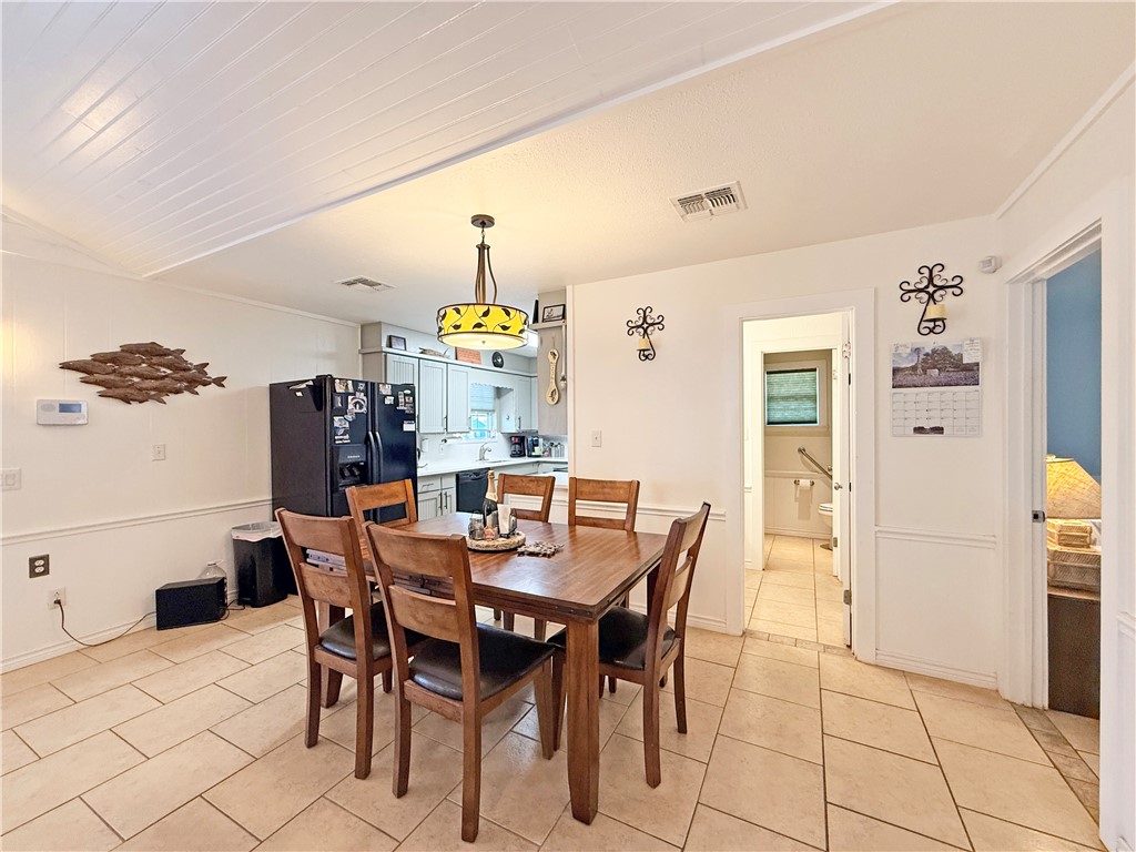 105 Copano Cove Road Rockport, TX 78382 - Photo 6 of 40 a view of a dining room and livingroom with furniture