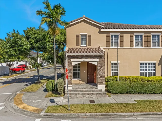 a view of a house with a yard