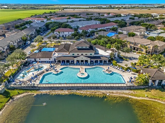 an aerial view of a house with a lake view