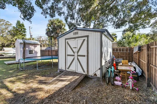 a view of swimming pool with outdoor seating and a patio