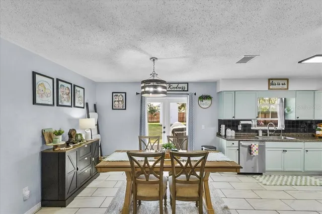 a kitchen with stainless steel appliances kitchen island granite countertop a sink and cabinets