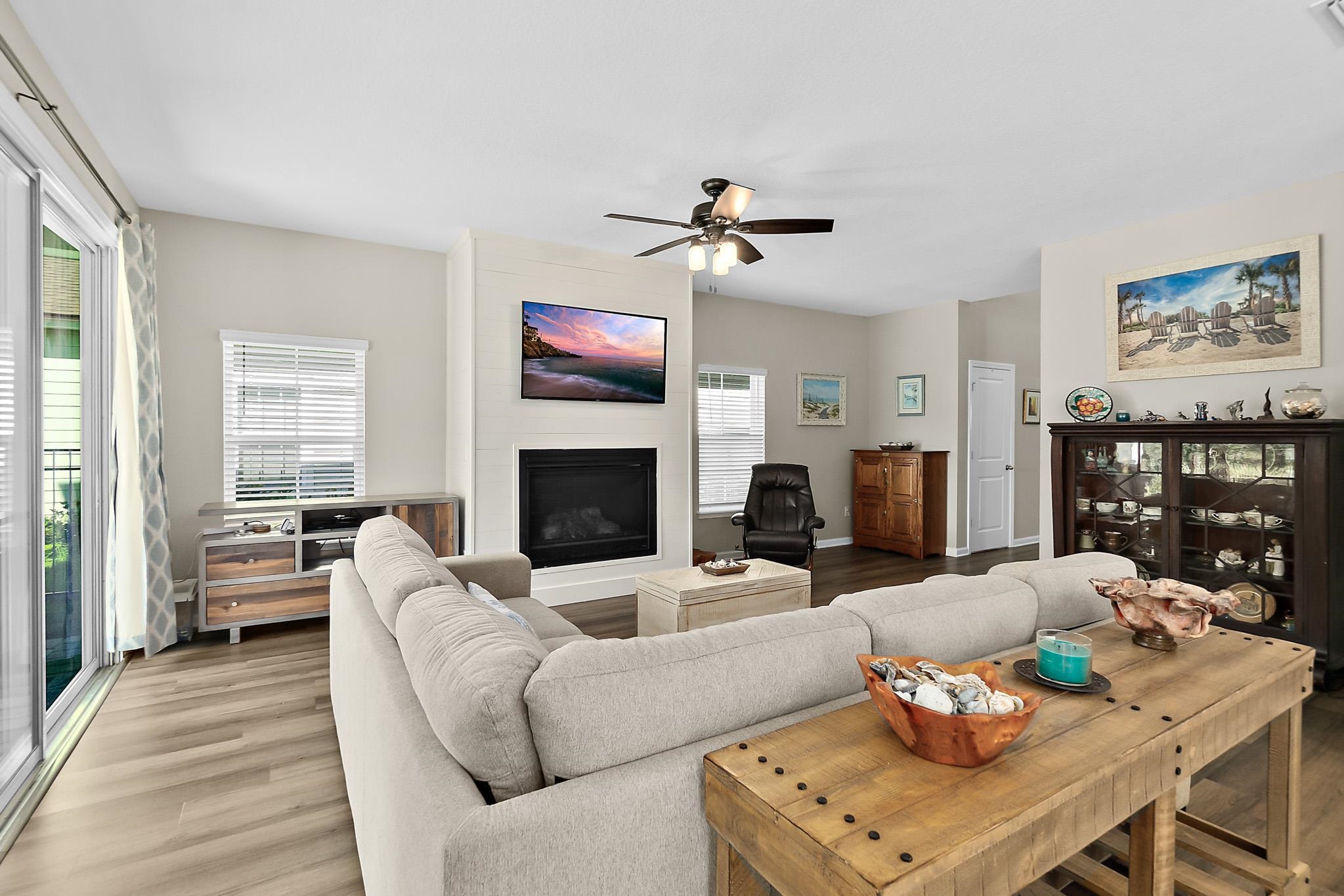 157 Ferndale Way St. Augustine, FL 32092 - Photo 12 of 82 a living room with furniture a fireplace and a flat screen tv