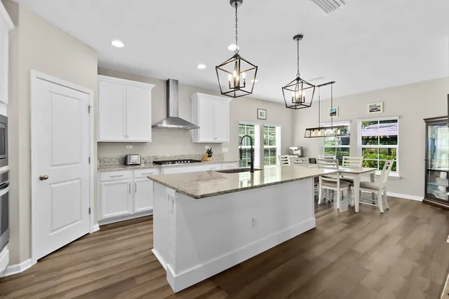 a kitchen with stainless steel appliances granite countertop a stove and a granite counter tops