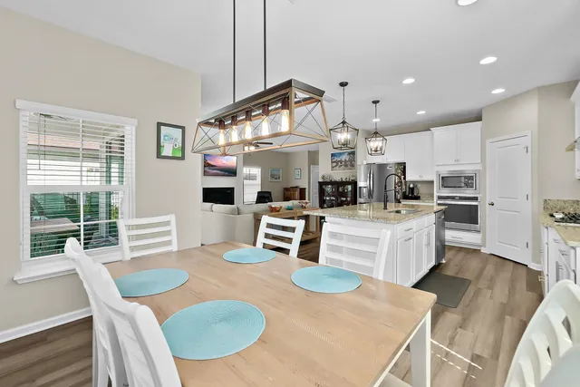 a view of a livingroom with furniture and a window