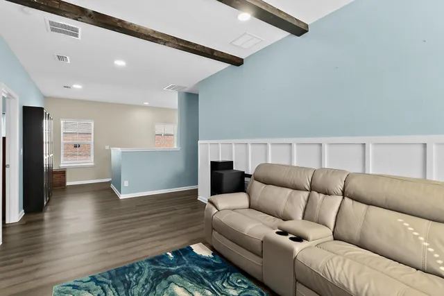 a view of a chairs and table in patio