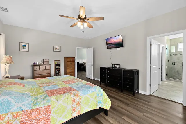 a view of a workspace with furniture and a cabinet