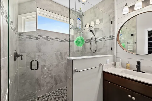 a bathroom with a bathtub and a shower