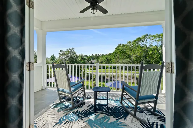 a view of a table and chairs under an umbrella