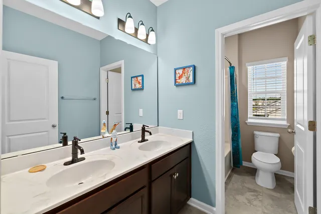 an aerial view of residential houses with outdoor space and street view